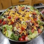 Dorito Taco Salad with seasoned beef and crushed Doritos