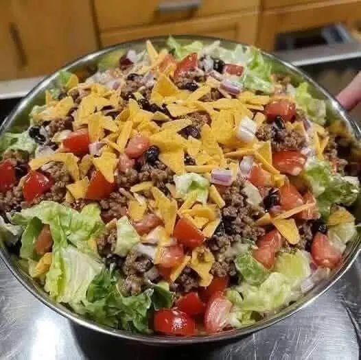 Dorito Taco Salad with seasoned beef and crushed Doritos