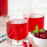 Cranberry juice benefits shown in fresh glasses with cranberries